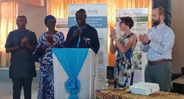 Shani Alhassan Shaibu (middle), Northern Regional Minister being supported by  Maureen Malave (2nd from right), Nutrition and Social Protection Lead USAID Ghana, Pualina Addy(2nd from left), Director of WIAD and others to announce the grant