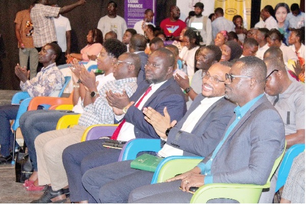  Kwabena Asamoah Boahene (3rd left),  Editor of Graphic Business, and some dignitaries applauding the contestants.