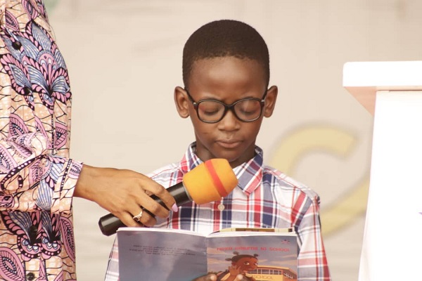 A pupil reading an excerpt of one of the books during the launch 