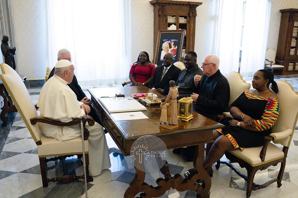 Fr. Andrew Campbell and his team sitting with His Holiness Pope Francis.