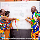 Osabarima Kwesi Atta II (2nd from right), Omanhen of Oguaa Traditional Area, Osagyefo Kwame Akonu X (left), the Paramount Chief of Anyan-Abaasa Traditional Area, and Janet Edna Nyame, the Executive Director of the National Commission on Culture, unveiling the banner for the NAFAC 2022 celebration