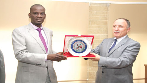 Haruna Iddrisu receiving a present from an official TAMTEST