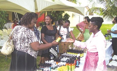 Prospective buyers checking some sheabutter products