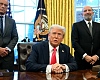 US President Donald Trump speaks to the press after signing an Executive Order, alongside US Secretary of Health and Human Services Robert F. Kennedy Jr. (L) and US Secretary of Commerce nominee Howard Lutnick (R), at the Oval Office of the White House in Washington, DC on February 25, 2025. 