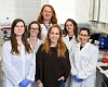 Prof Yifat Merbl, centre in black, with the rest of her lab team