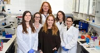 Prof Yifat Merbl, centre in black, with the rest of her lab team